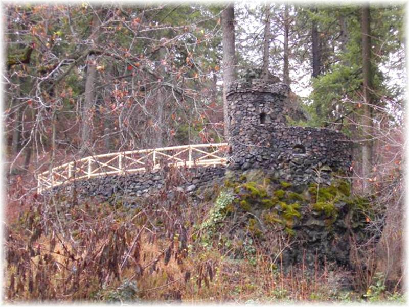 The restored castle with new pine fencing.